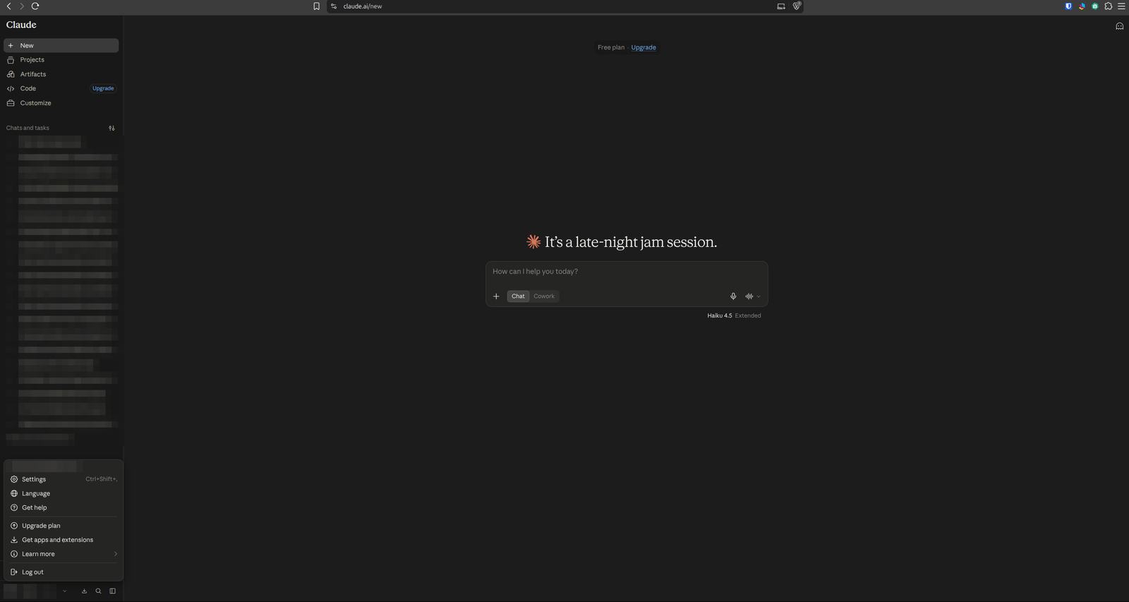 Claude with the account menu open at the bottom left of the sidebar and the Settings item highlighted